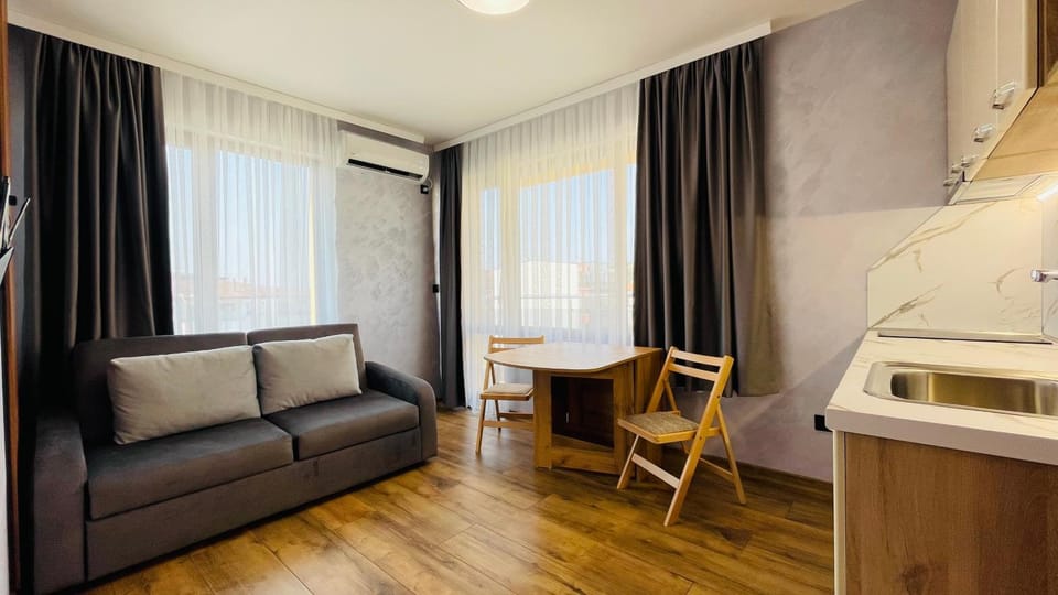 Kitchen or kitchenette, Living room, Seating area, Dining area, air conditioner