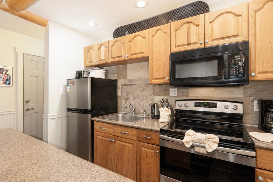 Kitchen or kitchenette, microwave, stove, kitchen