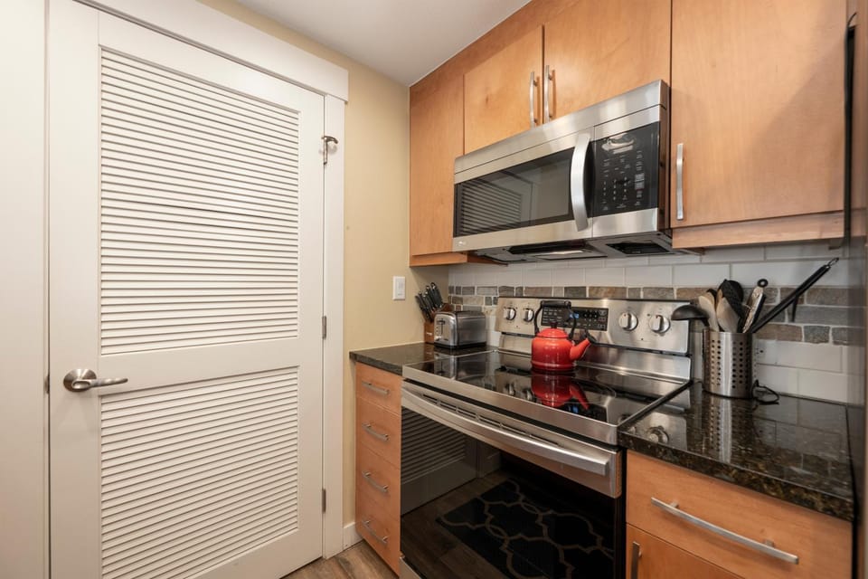 Kitchen or kitchenette, microwave, oven, stove, kitchen