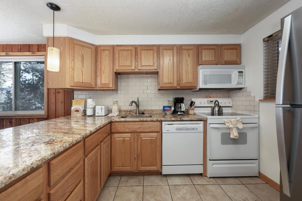 Kitchen or kitchenette, dishwasher, microwave, oven, stove, kitchen