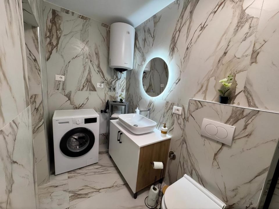 Property building, Bathroom, towels, washing machine, dryer
