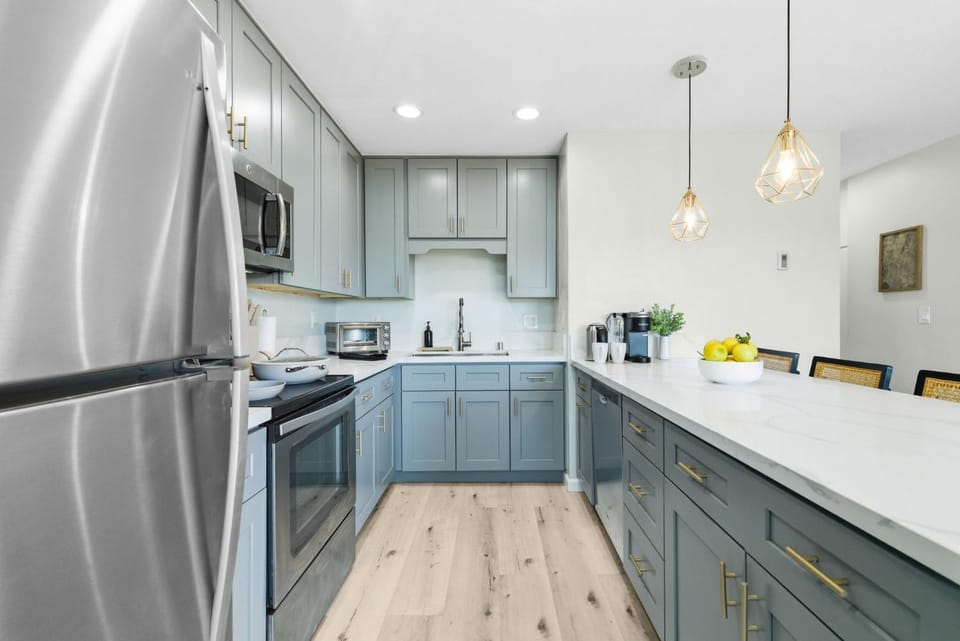 Kitchen or kitchenette, dishwasher, oven, stove