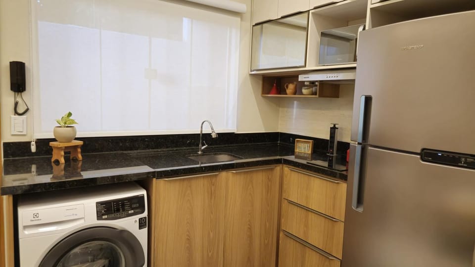 Kitchen or kitchenette, washing machine