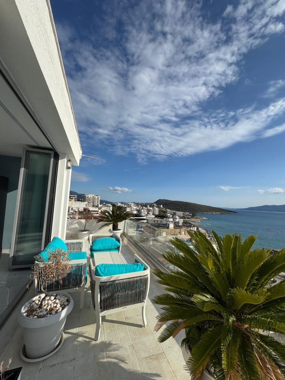 Property building, Patio, Day, View (from property/room), Balcony/Terrace, Living room, Seating area, Mountain view, Sea view, sunbed
