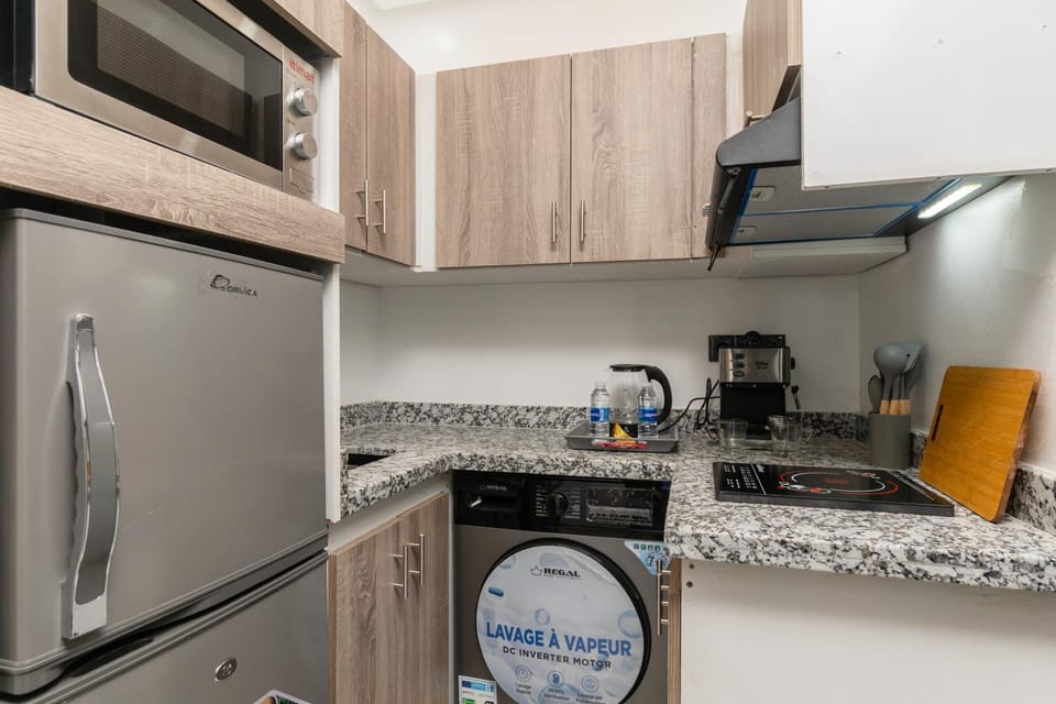 Kitchen or kitchenette, stove, washing machine