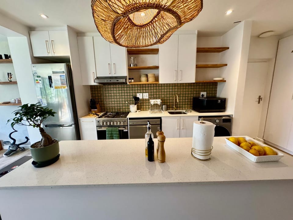 Kitchen or kitchenette, dishwasher, microwave, oven, stove, washing machine, dryer, kitchen