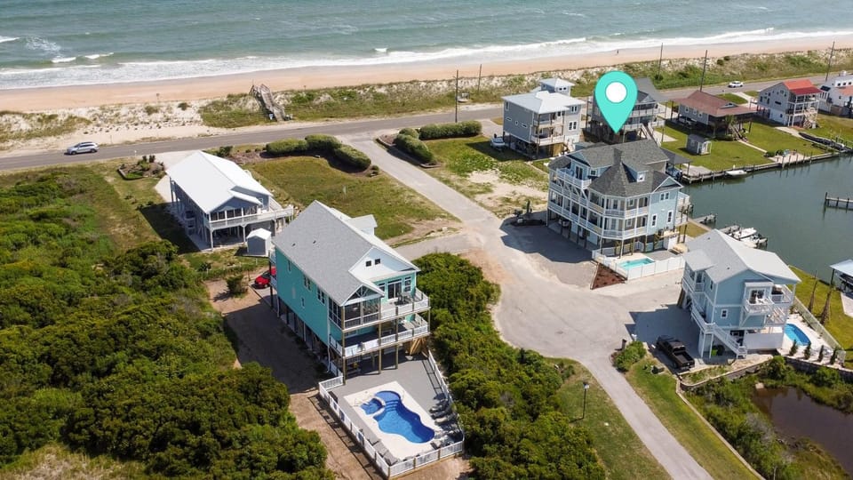 Experience waterfront luxury at Nautical Pointe, a 7-bedroom ocean view home in North Topsail Beach House in North Topsail Beach