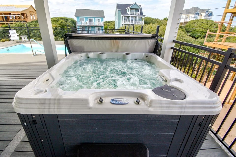 Experience luxury at Fin & Tonic, a 4-bedroom house with ocean views in North Topsail Beach House in North Topsail Beach