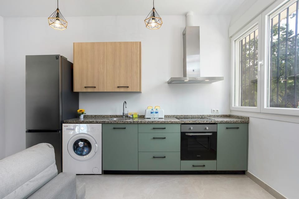 Kitchen or kitchenette, oven, stove, washing machine