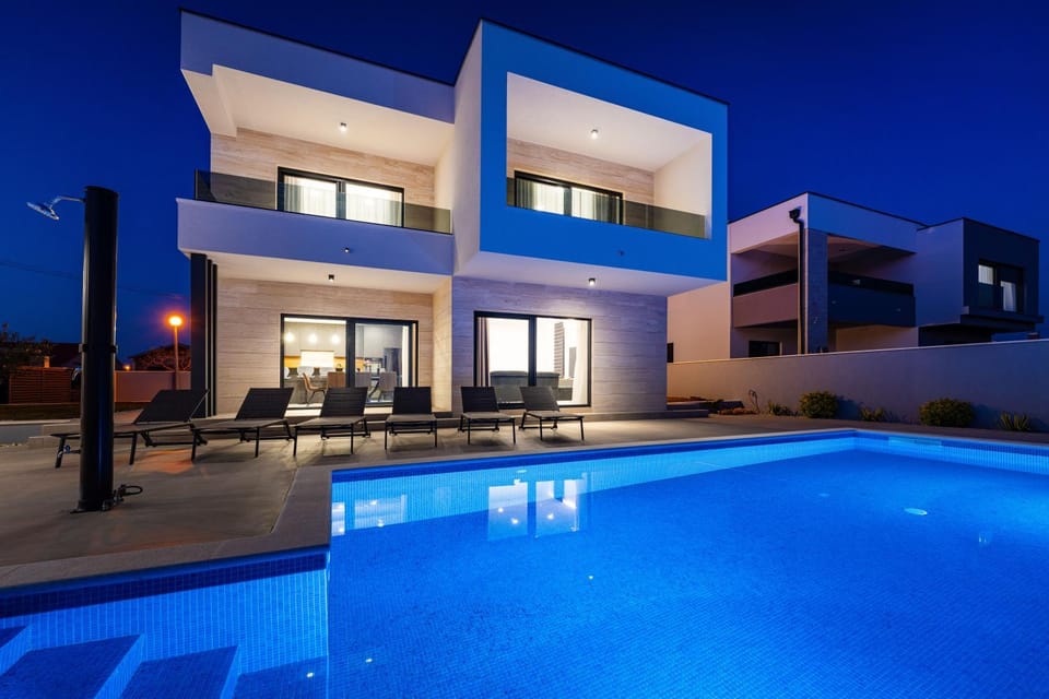 Property building, Patio, Night, Pool view, Swimming pool, sunbed