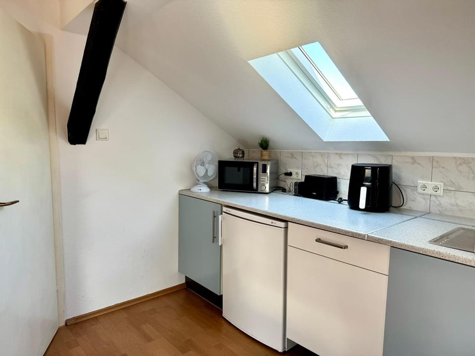 Kitchen or kitchenette, stove, toaster