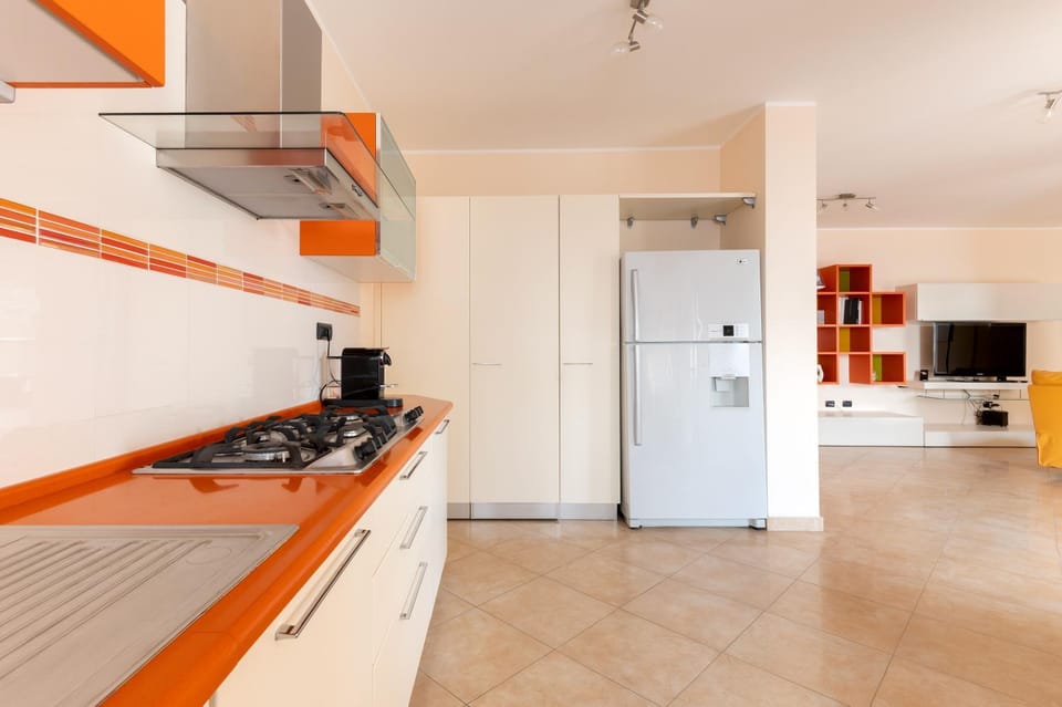 Kitchen or kitchenette, dishwasher, oven, stove