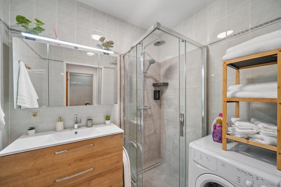 Shower, Bathroom, flat iron, hair dryier, towels, laundry, washing machine