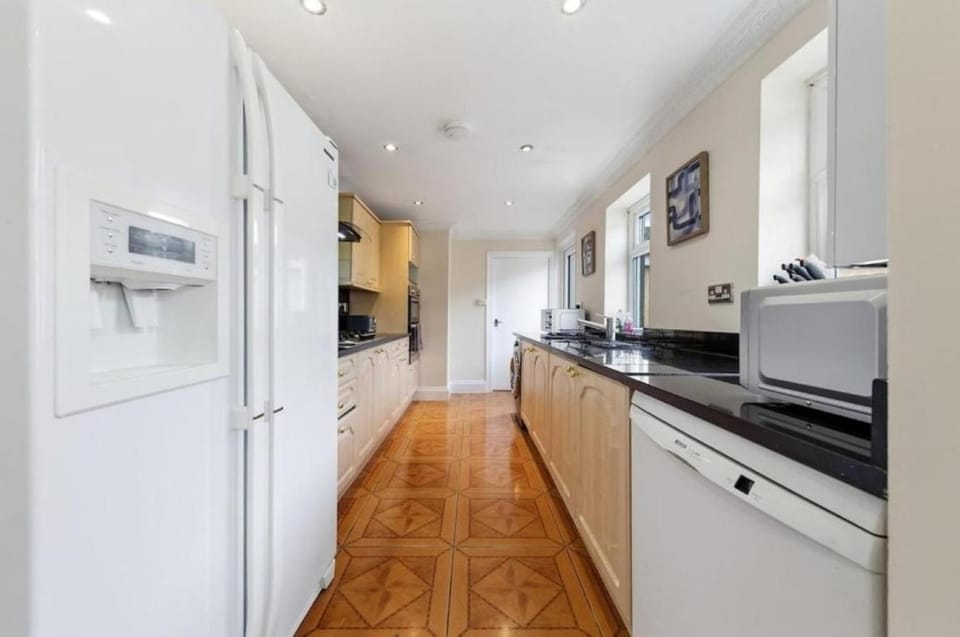 Kitchen or kitchenette, dishwasher, oven, stove
