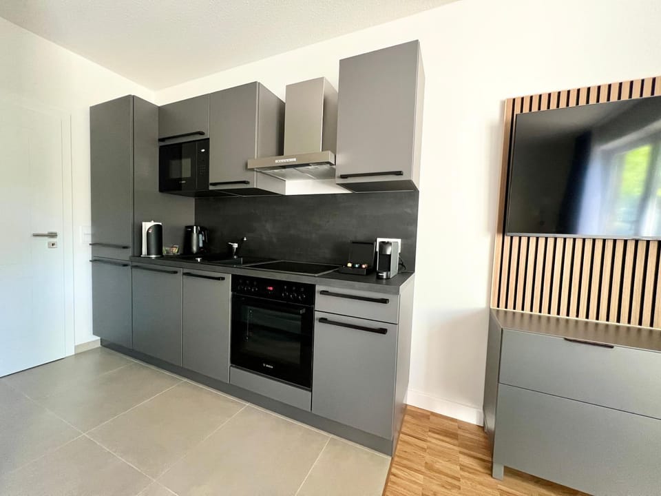 Kitchen or kitchenette, dishwasher, oven, stove, toaster