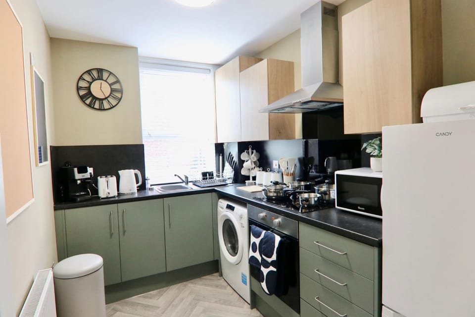 Kitchen or kitchenette, dishwasher, oven, stove, washing machine