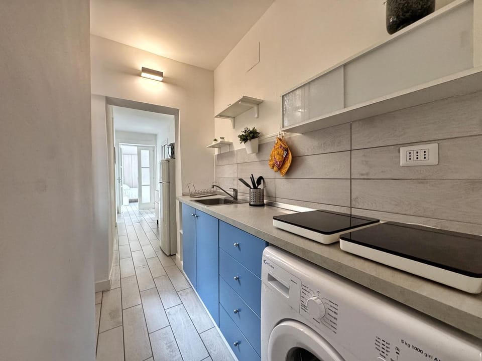 Kitchen or kitchenette, stove, washing machine