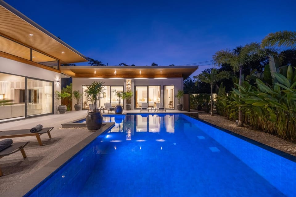 Property building, Patio, Night, Pool view, Swimming pool, sunbed