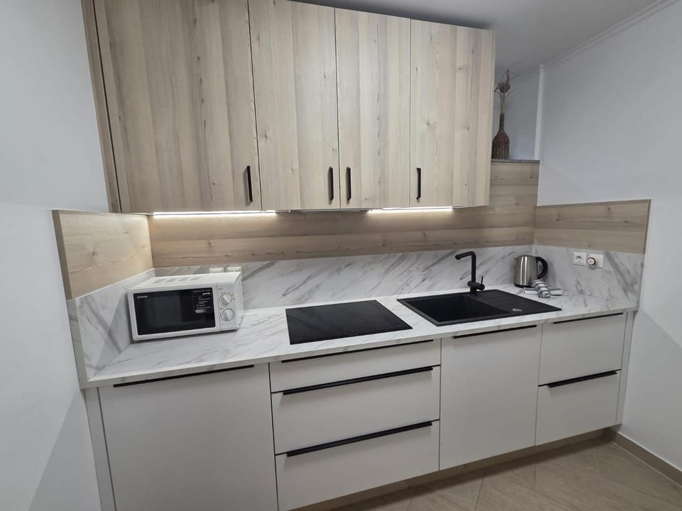 Kitchen or kitchenette, microwave