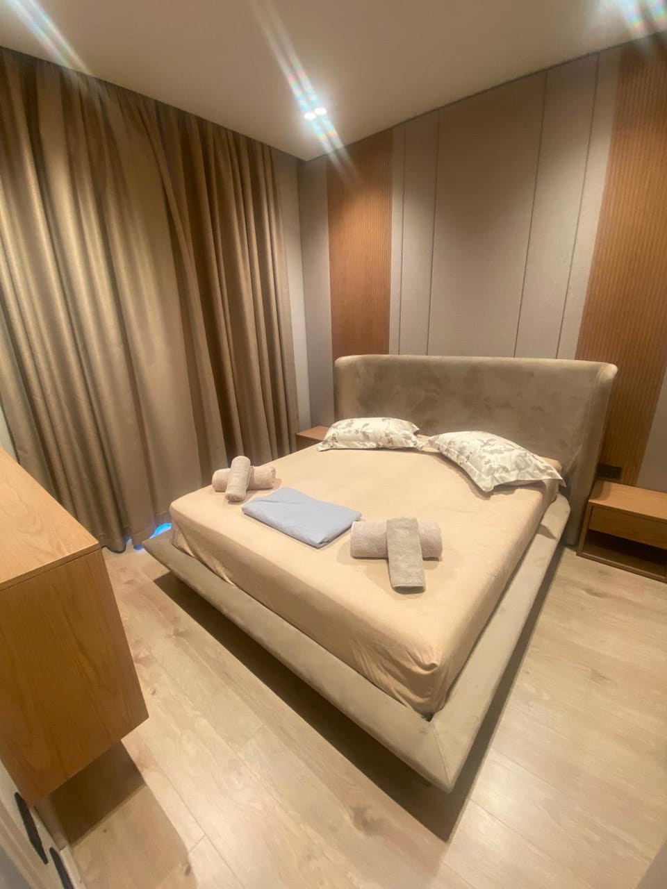 Bed, towels, wardrobe