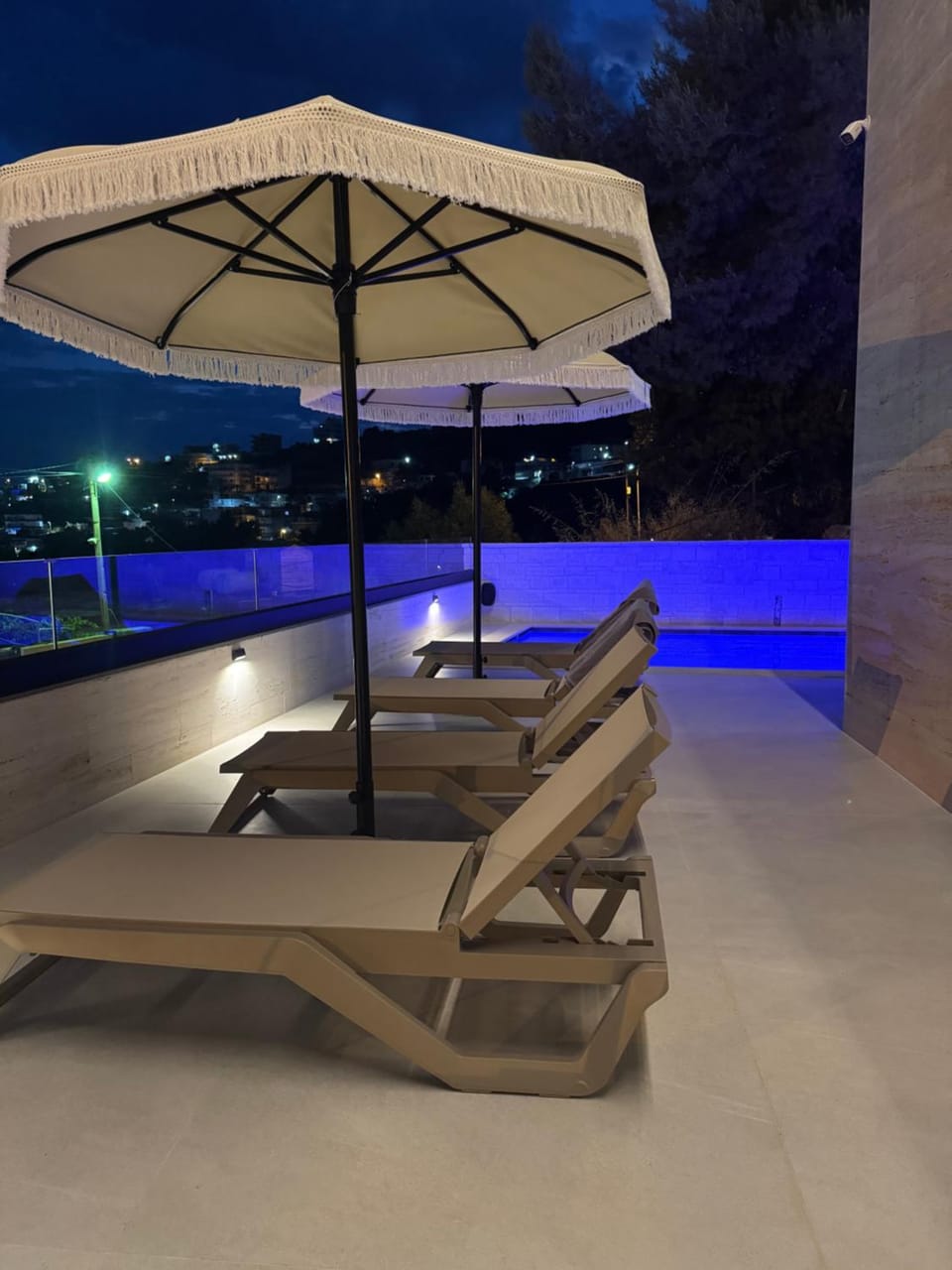 Patio, Night, Pool view, Swimming pool, sunbed
