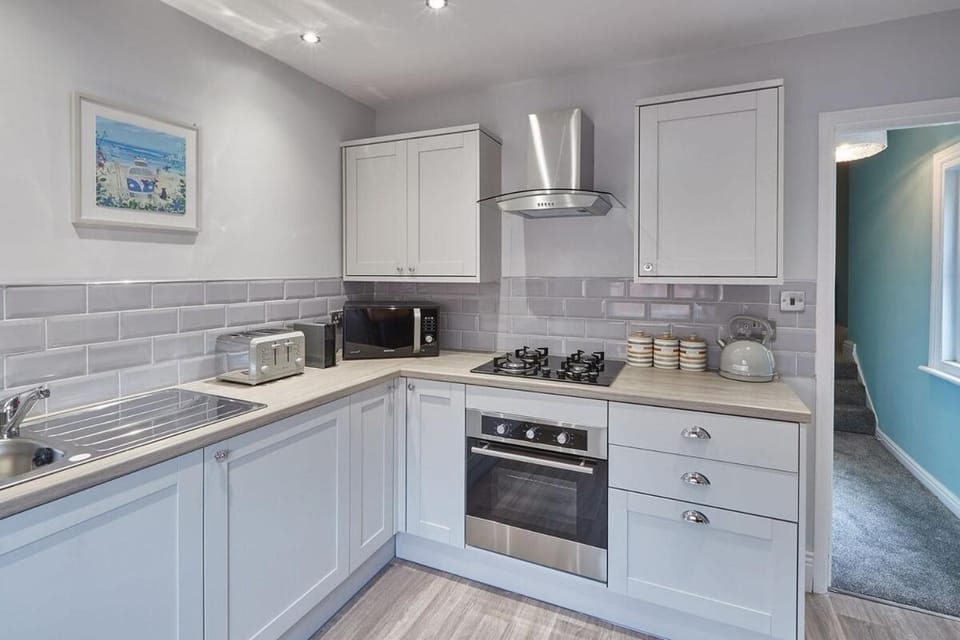 Kitchen or kitchenette, microwave, oven, stove, toaster