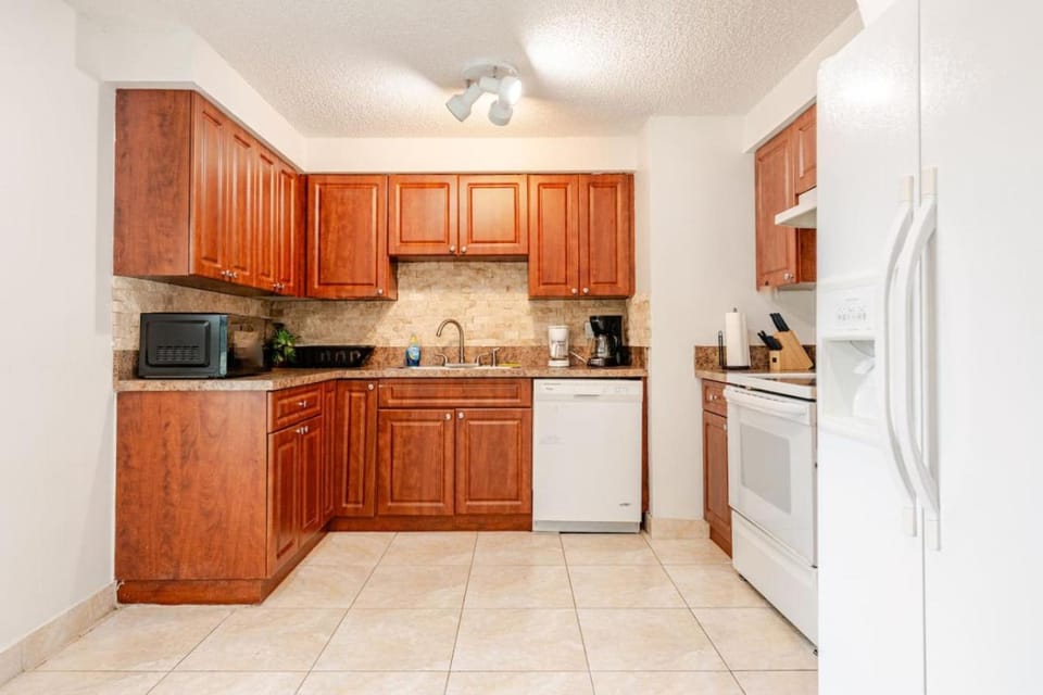 Kitchen or kitchenette, dishwasher, oven, stove, toaster