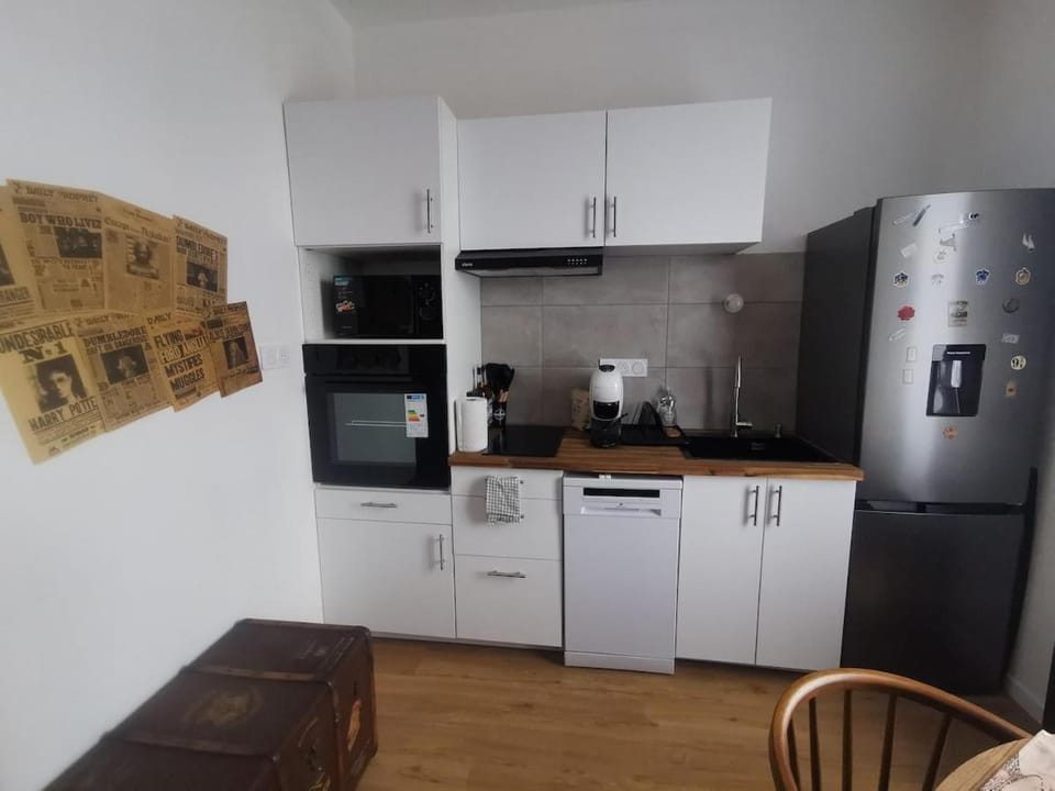 Kitchen or kitchenette, dishwasher, microwave, oven, stove