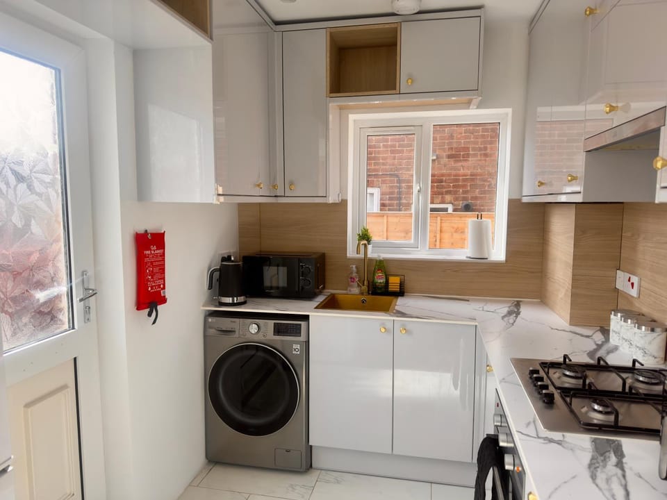 microwave, toaster, washing machine, kitchen