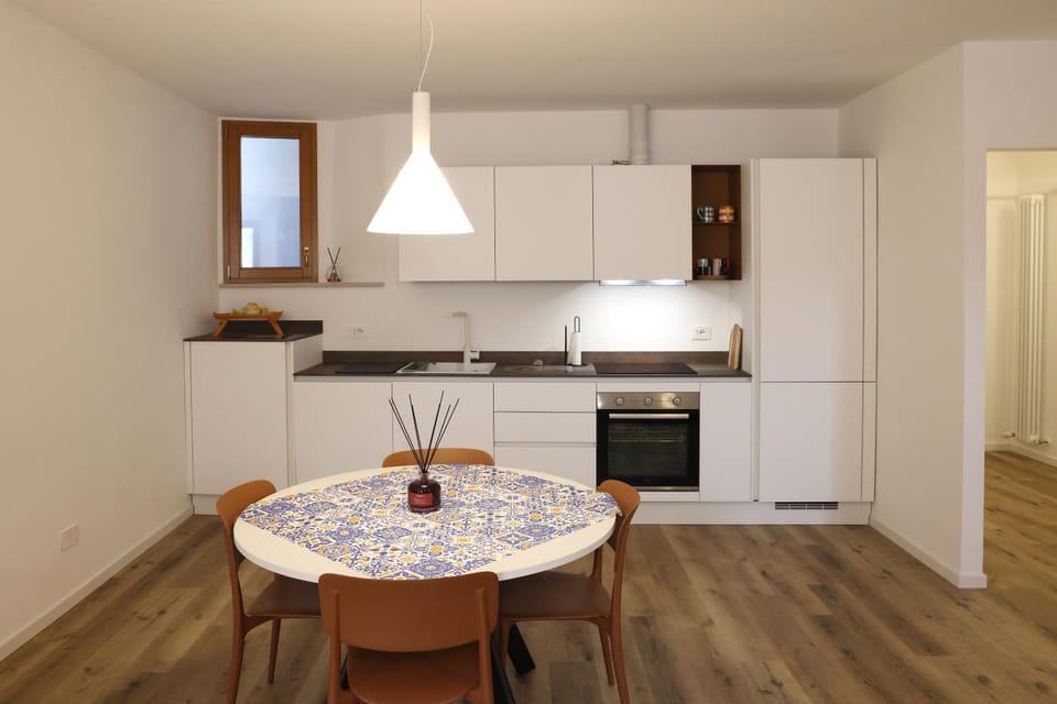 Kitchen or kitchenette, dishwasher, oven, stove