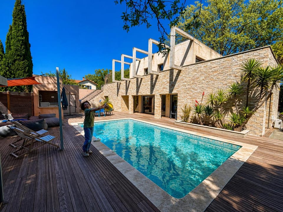 Property building, Patio, Pool view, Swimming pool, sunbed