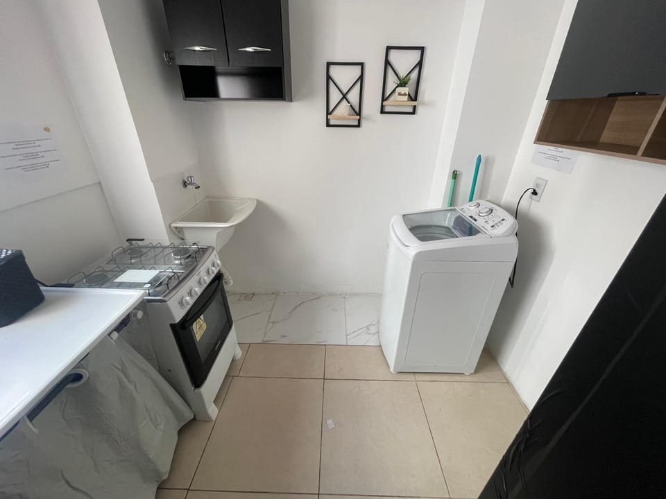 Kitchen or kitchenette, oven, stove, laundry