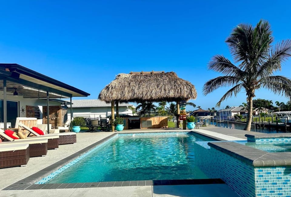 TIKI on the CANAL mini-putt poolspa kayak fishing House in Cape Coral
