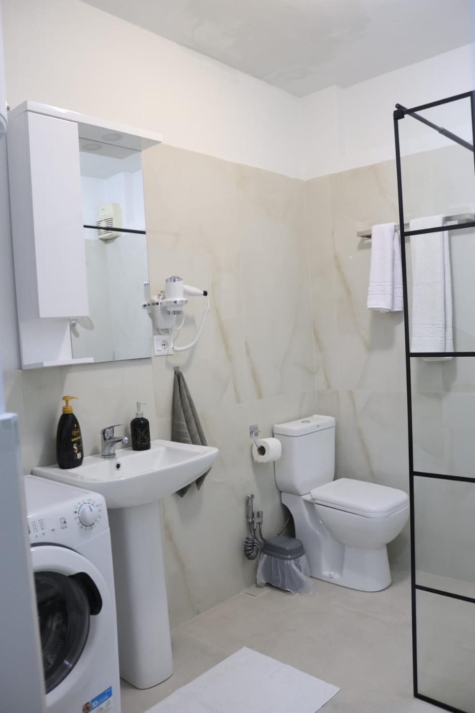 Shower, Toilet, Bathroom, bidet, towels, washing machine, dryer