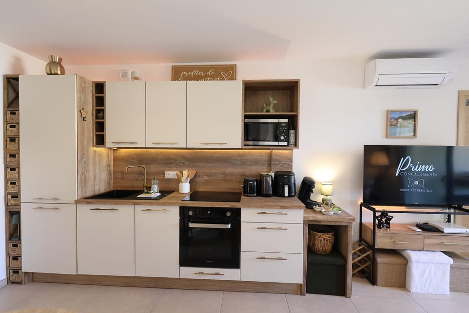 Kitchen or kitchenette, dishwasher, oven, stove, toaster