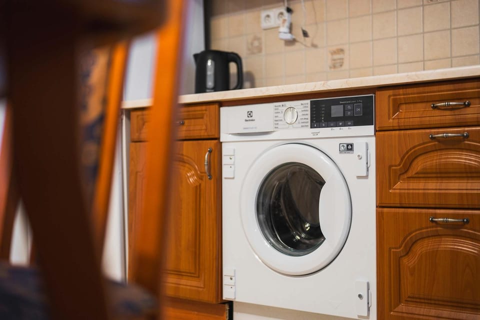 Kitchen or kitchenette, washing machine