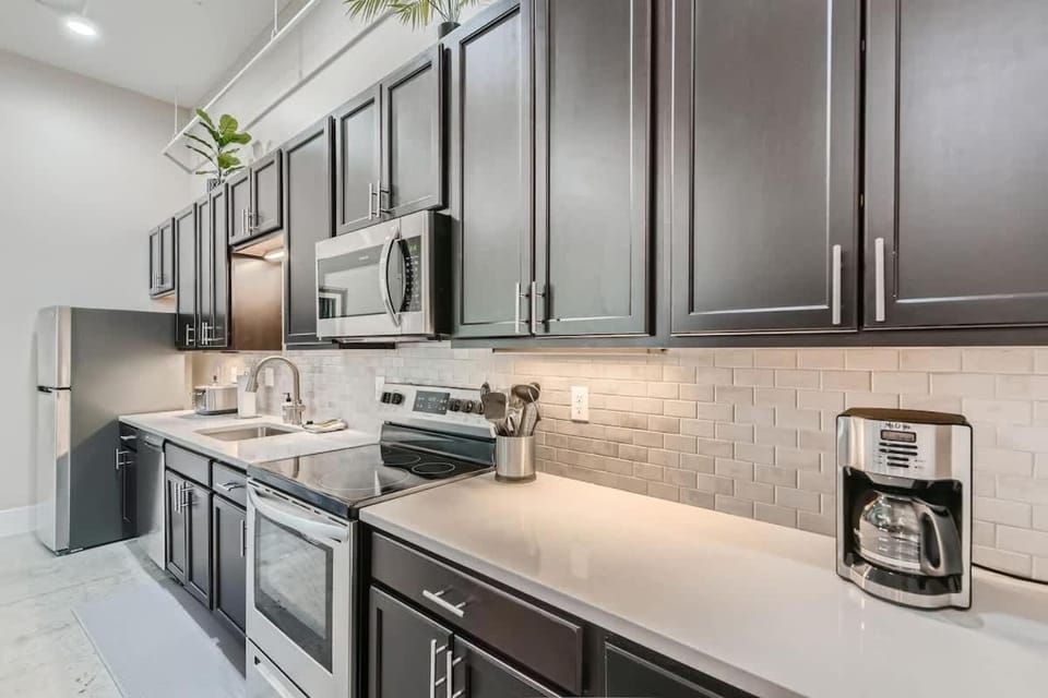 Kitchen or kitchenette, dishwasher, oven, stove, toaster