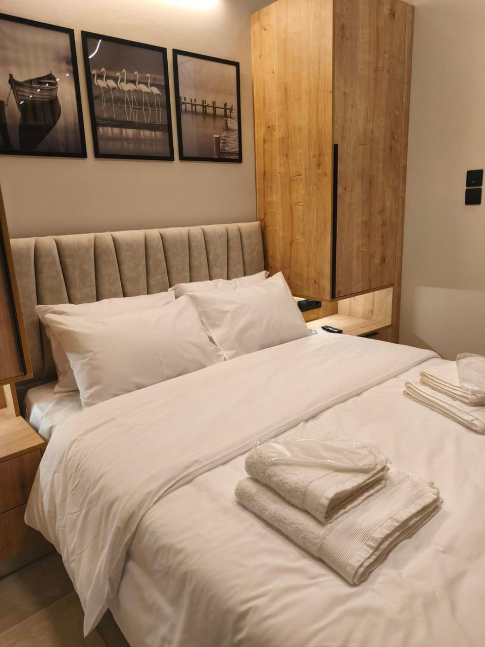 Bed, towels, wardrobe