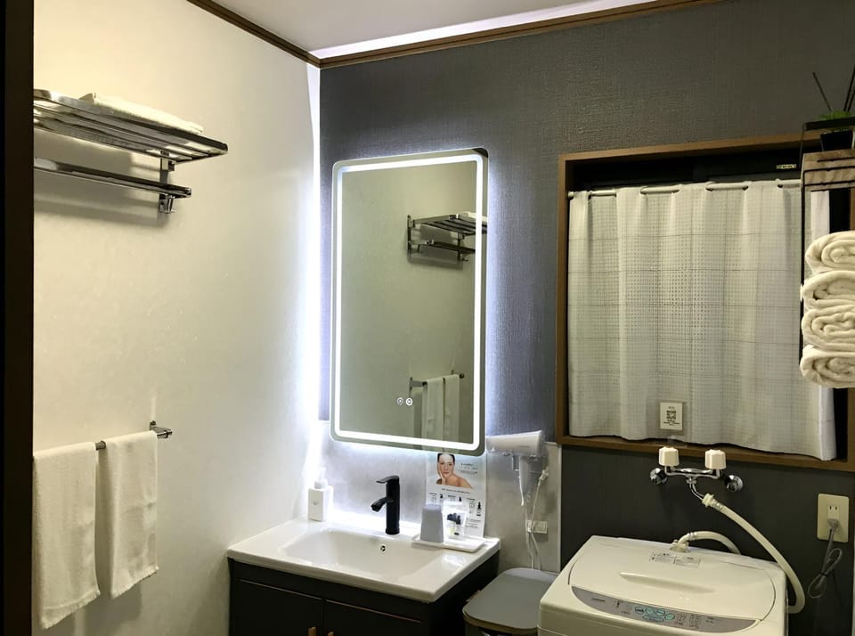 Bathroom, towels, washing machine