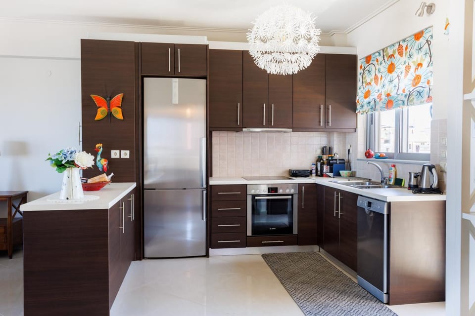 Kitchen or kitchenette, dishwasher, oven, stove