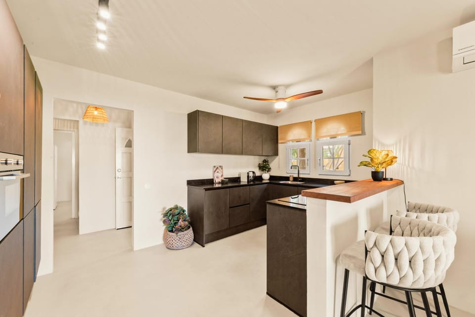 Kitchen or kitchenette, dishwasher, oven, stove