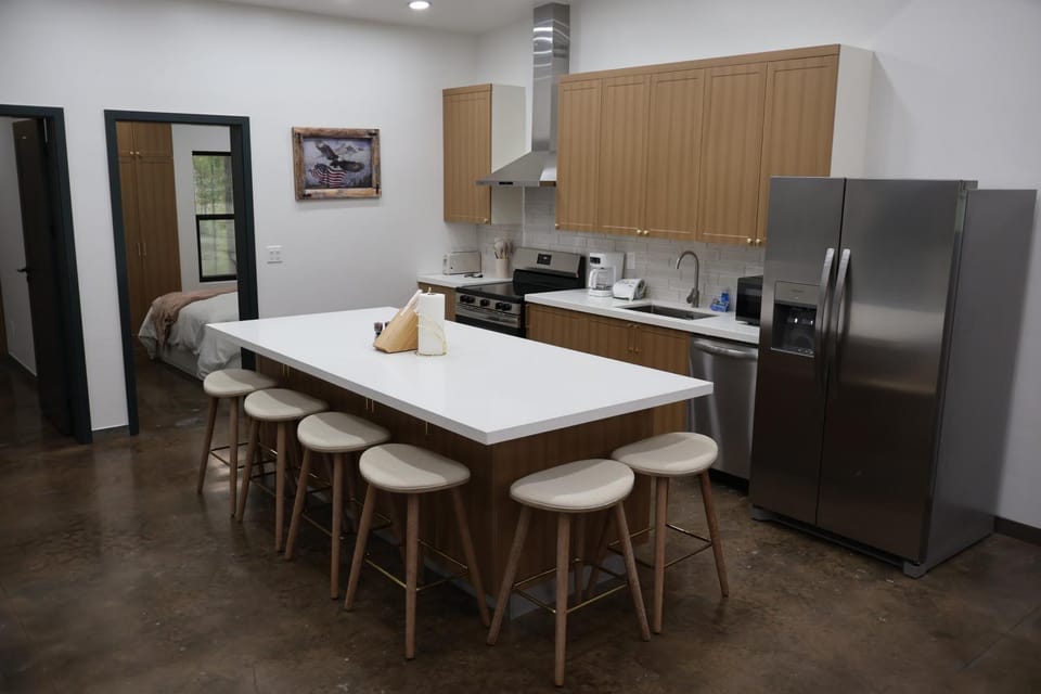 Kitchen or kitchenette, dishwasher, oven, stove