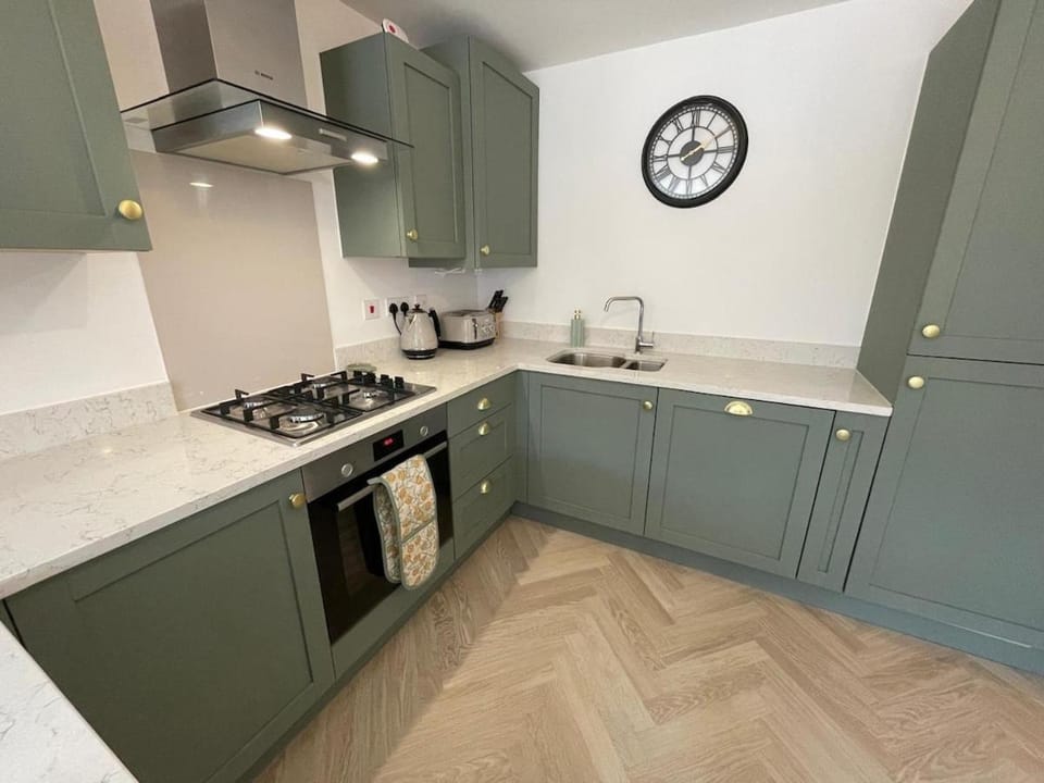 microwave, oven, stove, towels, kitchen