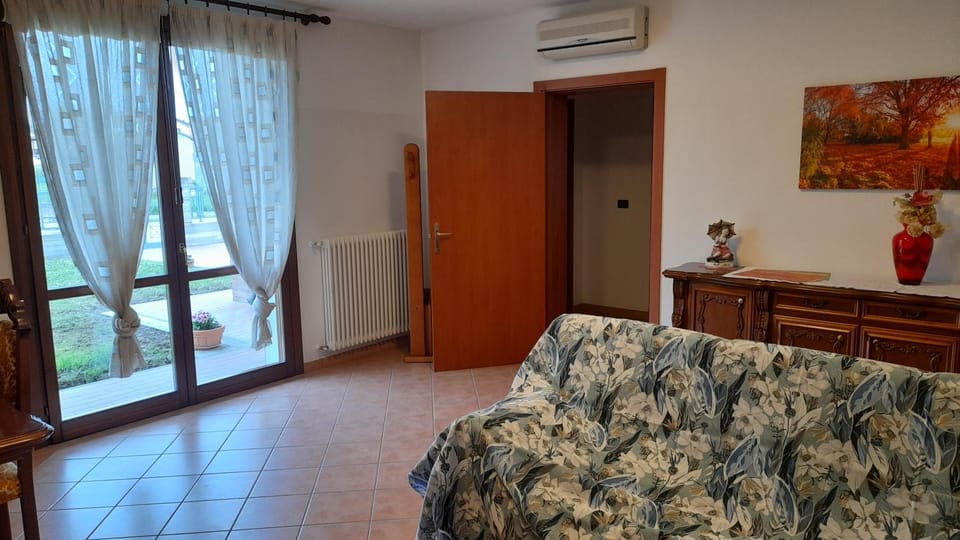 Living room, Seating area, Garden view, air conditioner
