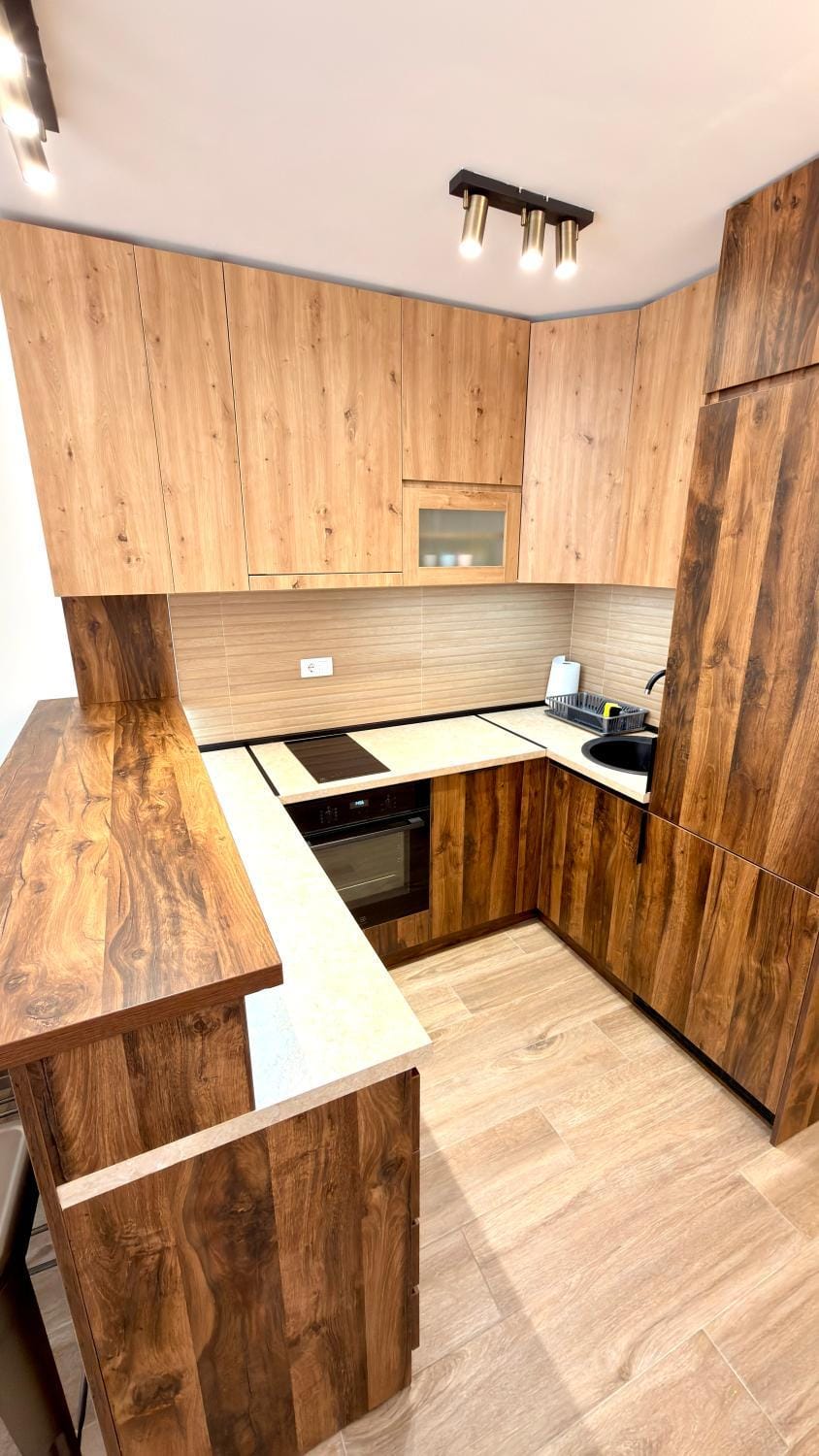 Kitchen or kitchenette, dishwasher, oven, stove