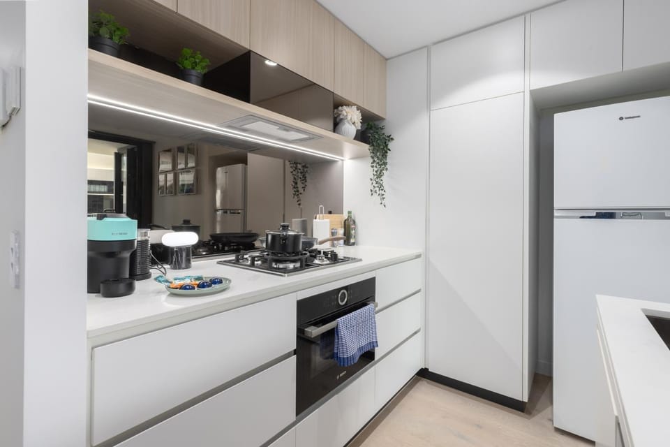 Kitchen or kitchenette, dishwasher, oven, stove