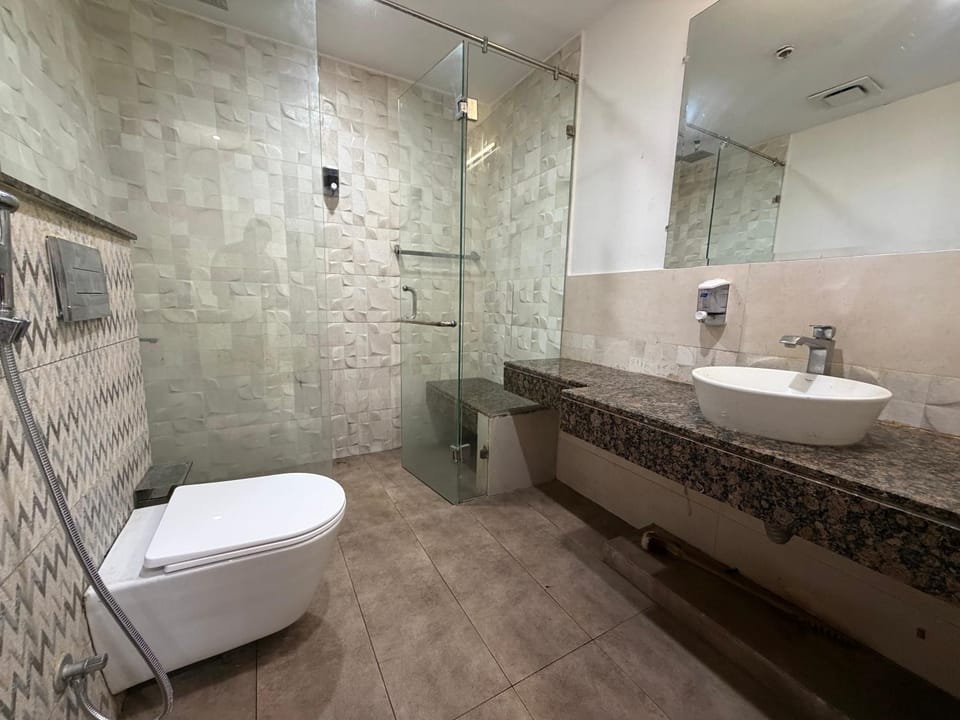 Premium 1 BHK Apartment with Massage Chair Goldcrest Apartment in Lahore