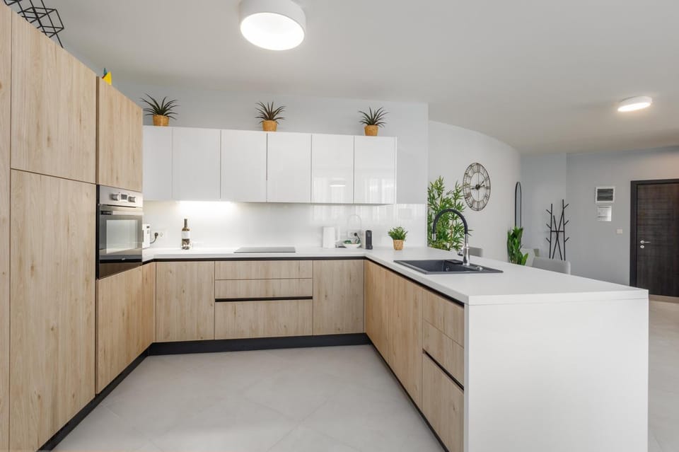 Kitchen or kitchenette, dishwasher, microwave, oven, stove