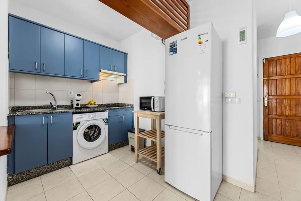 Kitchen or kitchenette, stove, washing machine