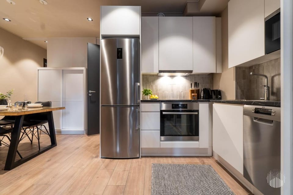 Kitchen or kitchenette, dishwasher, oven, stove, toaster